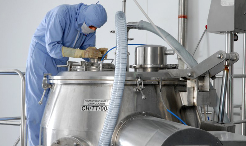 Zydus employee monitoring granulation manufacturing in the Moraiya plant.